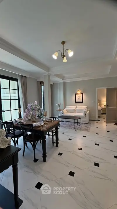 Elegant open-plan living and dining area with stylish decor and natural light