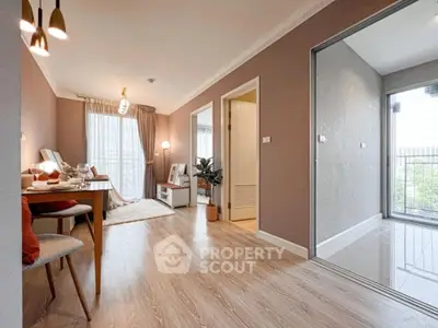 Spacious modern living room with elegant decor and large windows for natural light.