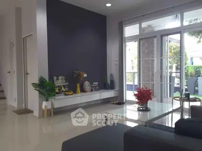Modern living room with large windows and stylish decor