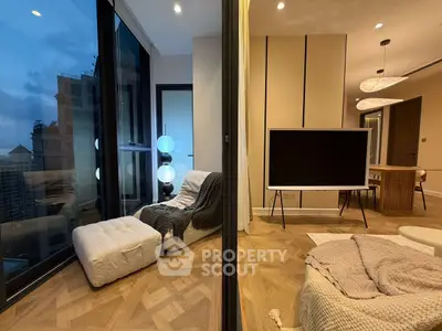 Modern living room with floor-to-ceiling windows and stylish decor