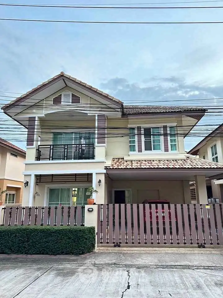Charming two-story house with modern design and spacious balcony in suburban neighborhood.