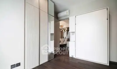Modern interior with sleek wooden flooring and built-in storage