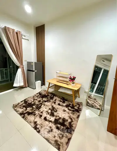 Modern living room with stylish decor and large mirror