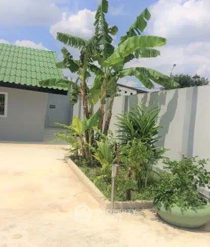 Charming garden view with lush greenery and modern exterior design.