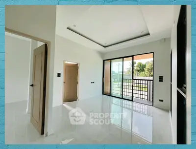 Spacious modern living room with large windows and glossy tile flooring