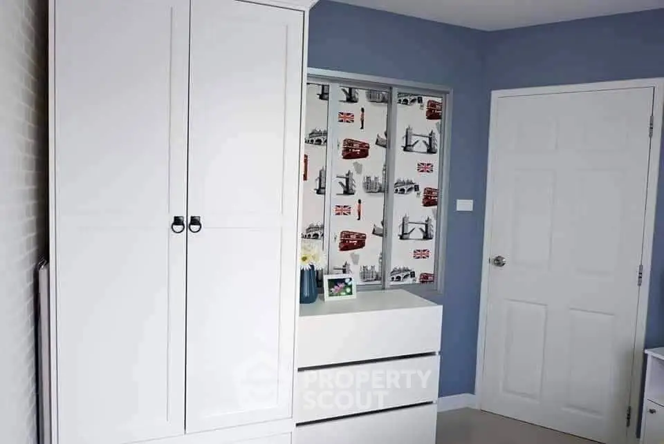 Charming bedroom with modern white wardrobe and stylish decor