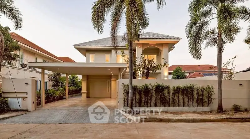 Stunning modern villa with spacious driveway and lush palm trees in a serene neighborhood.