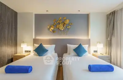 Modern twin bedroom with stylish decor and ambient lighting