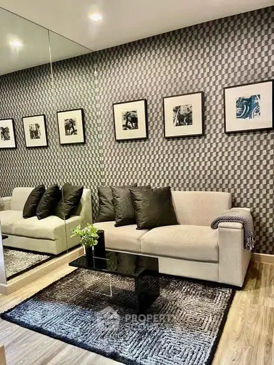 Stylish living room with modern decor, featuring a chic sofa and elegant wall art.
