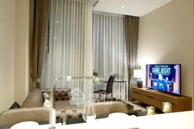 Luxurious living room with elegant decor and modern entertainment setup.