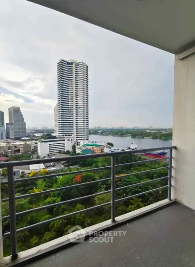 Stunning balcony view of city skyline and lush greenery, perfect for urban living enthusiasts.