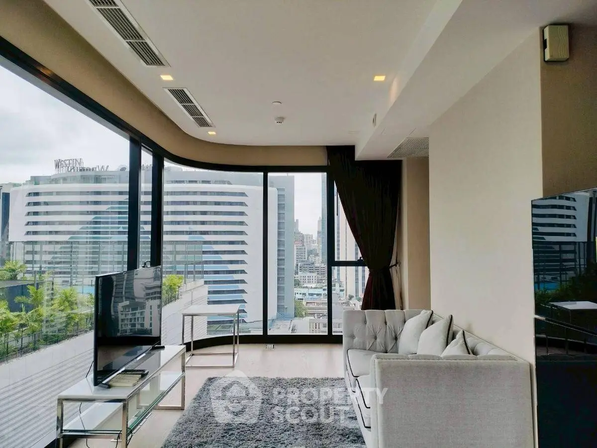 Luxurious corner unit living room with panoramic city views and modern furnishings.
