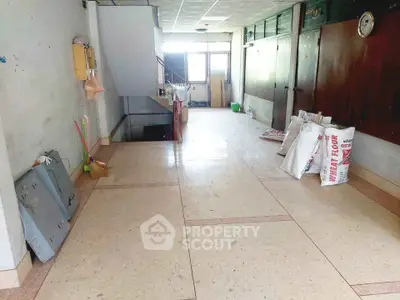 Spacious interior hallway with storage potential and natural light