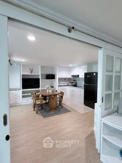 Spacious open-layout kitchen with dining area and modern appliances
