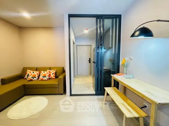 Modern living room with stylish decor and cozy seating area.