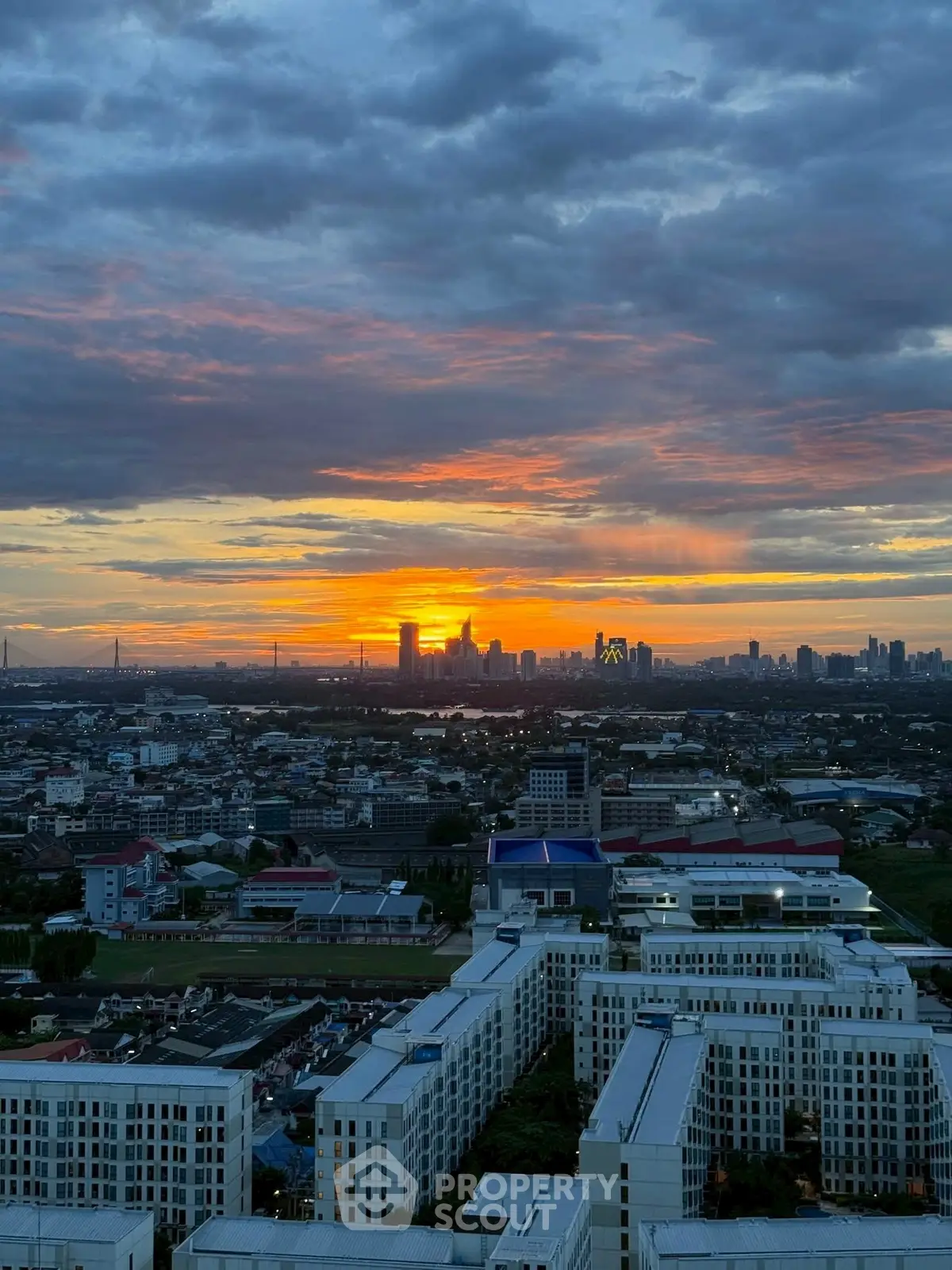 Stunning cityscape view at sunset with vibrant skyline and modern architecture.