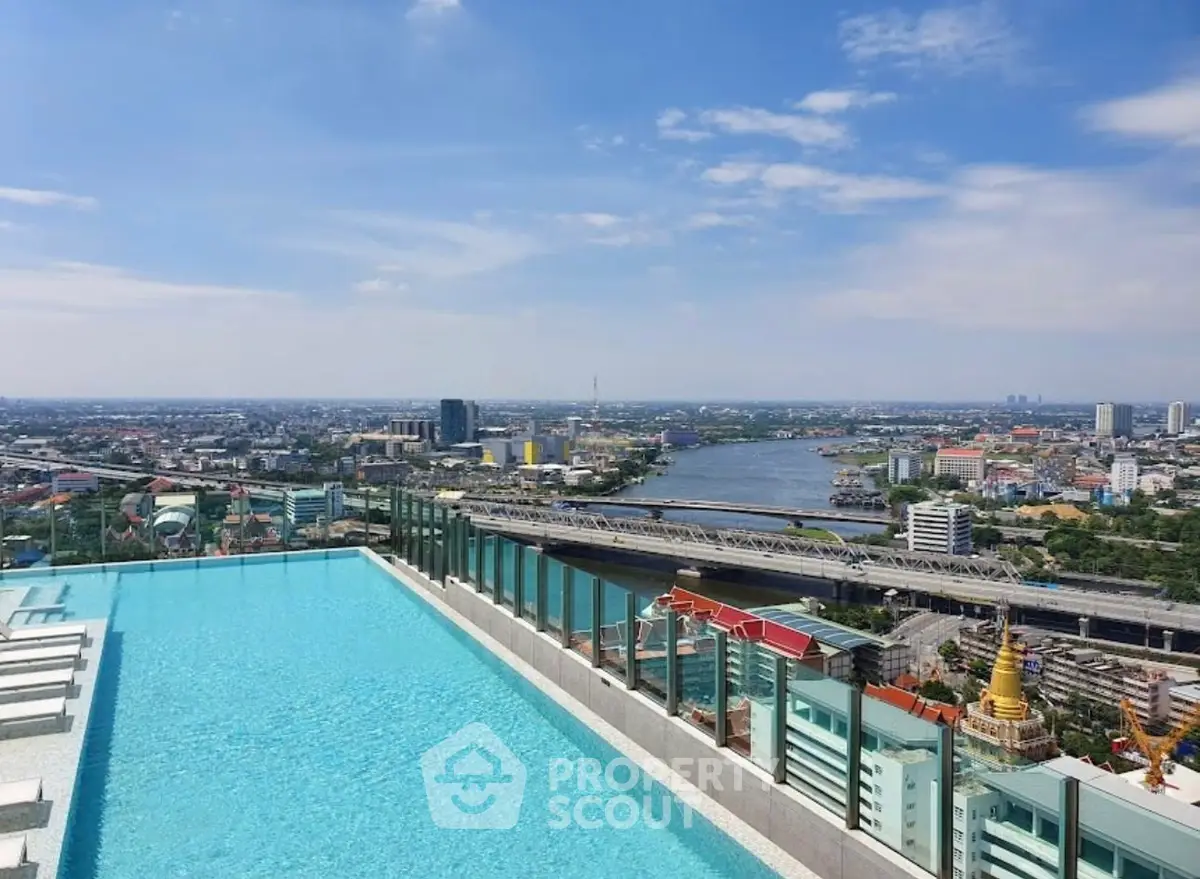 Stunning rooftop pool with panoramic city and river views, perfect for luxury urban living.