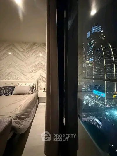 Luxurious bedroom with stunning city view through large window, featuring elegant decor and ambient lighting.