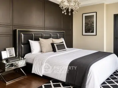 Luxurious bedroom with elegant decor and chandelier lighting