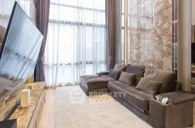 Luxurious living room with high ceilings and elegant decor