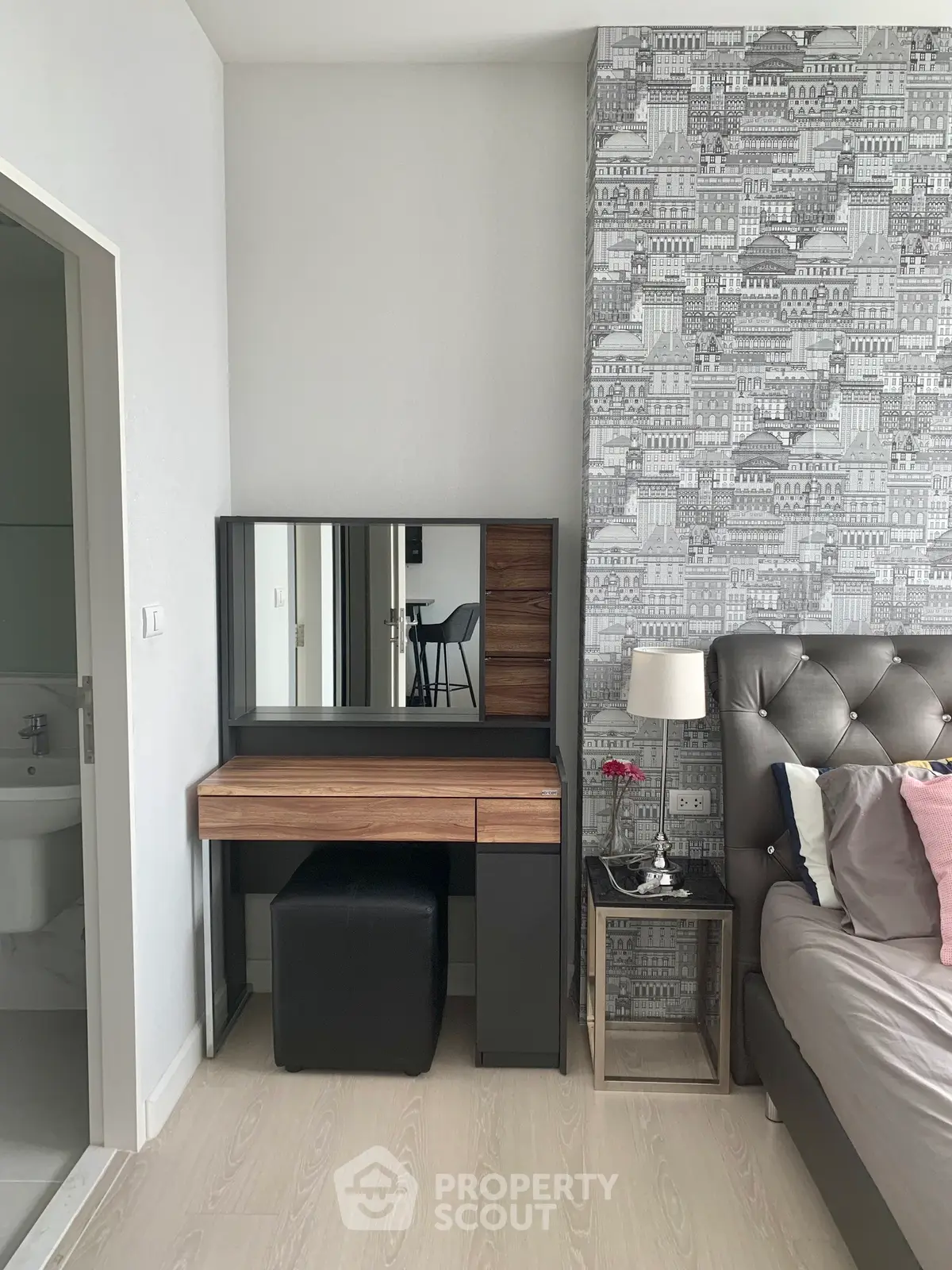 Stylish bedroom with modern vanity and elegant wallpaper design