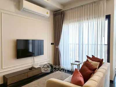 Modern living room with sleek TV setup and elegant curtains, perfect for cozy relaxation.