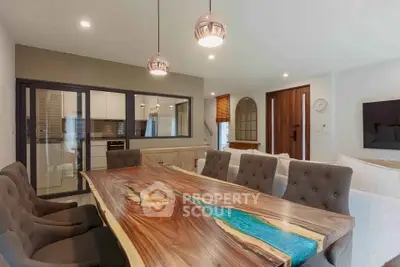 Stunning modern dining room with unique wooden table and elegant lighting, perfect for entertaining.