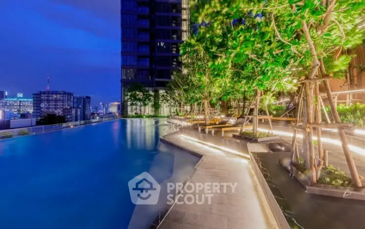 Luxurious rooftop pool with stunning city views and lush greenery at night.