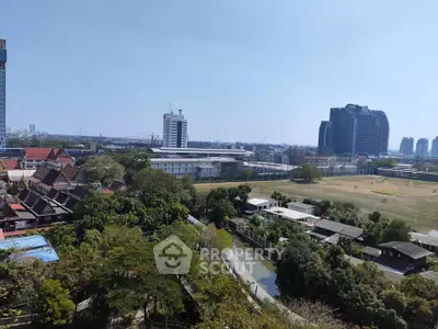 Stunning cityscape view with lush greenery and modern architecture, perfect for urban living enthusiasts.