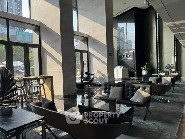 Luxurious modern lobby with stylish seating and floor-to-ceiling windows