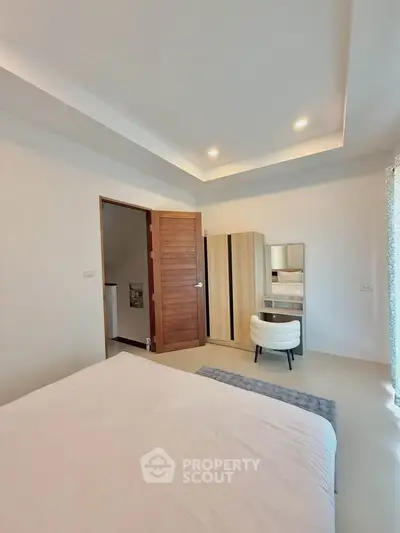 Modern bedroom with stylish furniture and natural light