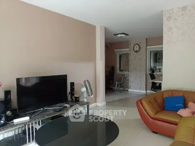 Spacious living room with modern decor and comfortable seating