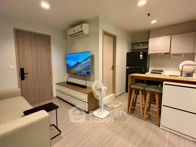 Modern living room with open kitchen and stylish decor