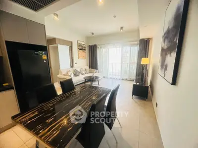 Modern living room with elegant dining area and natural light