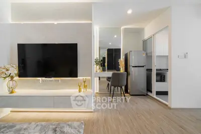 Modern living room with sleek TV setup and stylish dining area
