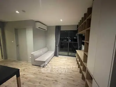 Modern living room with sleek design and balcony view in urban apartment