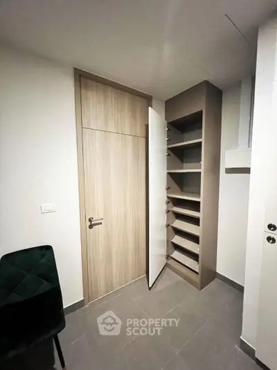 Modern storage room with sleek shelving and elegant door design