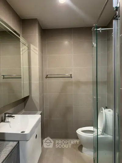 Modern bathroom with sleek design and glass shower enclosure