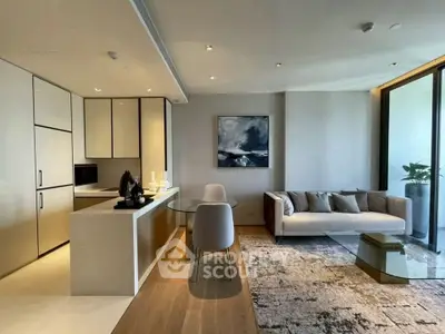Modern open-plan living room with sleek kitchen and stylish decor