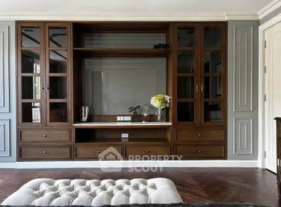 Elegant living room with built-in wooden shelving and stylish decor