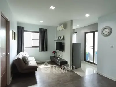 Modern living room with sleek design and balcony access