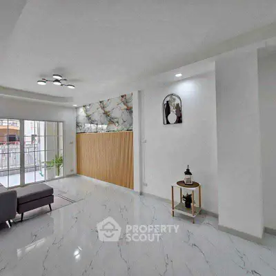 Modern living room with marble flooring and stylish decor
