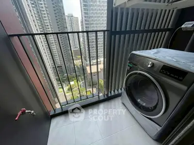 Modern high-rise balcony with washing machine and city view