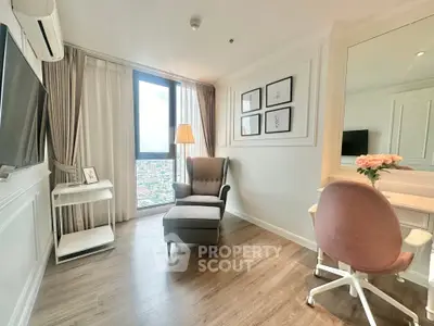 Elegant living room with city view, featuring cozy armchair and stylish decor.