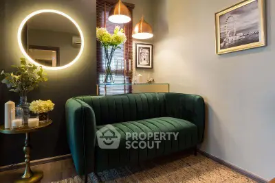 Chic living room with emerald green sofa and modern decor