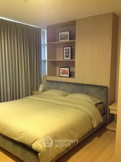 Cozy modern bedroom with stylish shelving and elegant decor