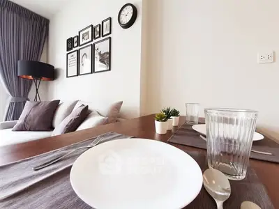 Modern dining area with stylish decor and cozy seating in a contemporary apartment.