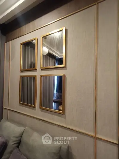 Elegant living room with stylish wall decor and plush sofa