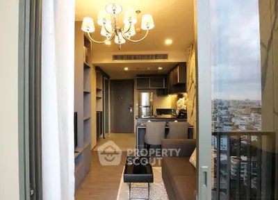 Modern apartment interior with open layout and city view from balcony.