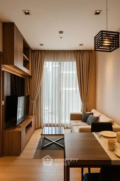 Modern living room with elegant decor, large window, and cozy seating area in a stylish apartment.